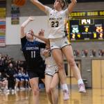 Shorecrests Cassie Chesnut leaps in the air to block a shot by Shorewoods Bridget Cox during the 3A district playoff game on Friday, Feb. 14, 2025 in Shoreline, Washington. (Olivia Vanni / The Herald)