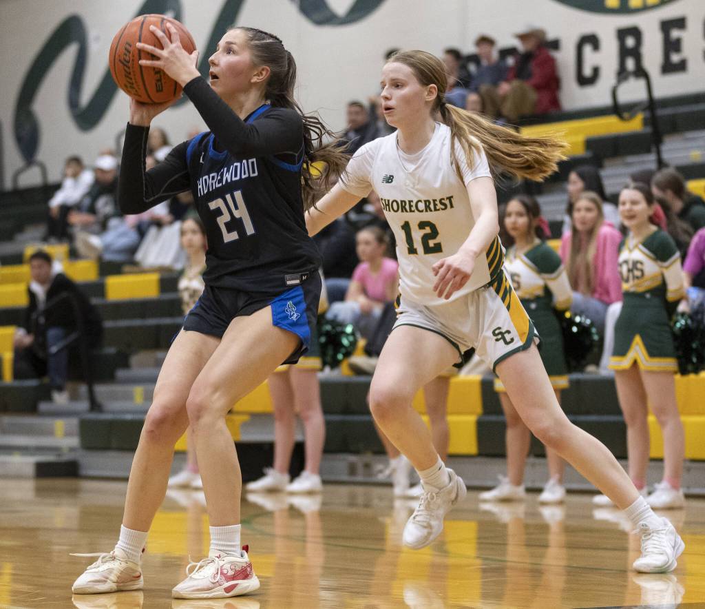Shorewoods Vanessa Spadafora fakes out Shorecrests Jorja Perrin to get a clear jump shot a during the 3A district playoff game on Friday, Feb. 14, 2025 in Shoreline, Washington. (Olivia Vanni / The Herald)