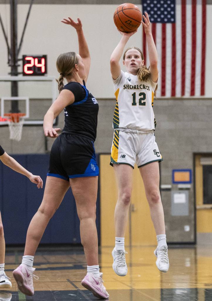 Shorecrests Jorja Perrin makes a three point shot during the 3A district playoff game against Shorewood on Friday, Feb. 14, 2025 in Shoreline, Washington. (Olivia Vanni / The Herald)