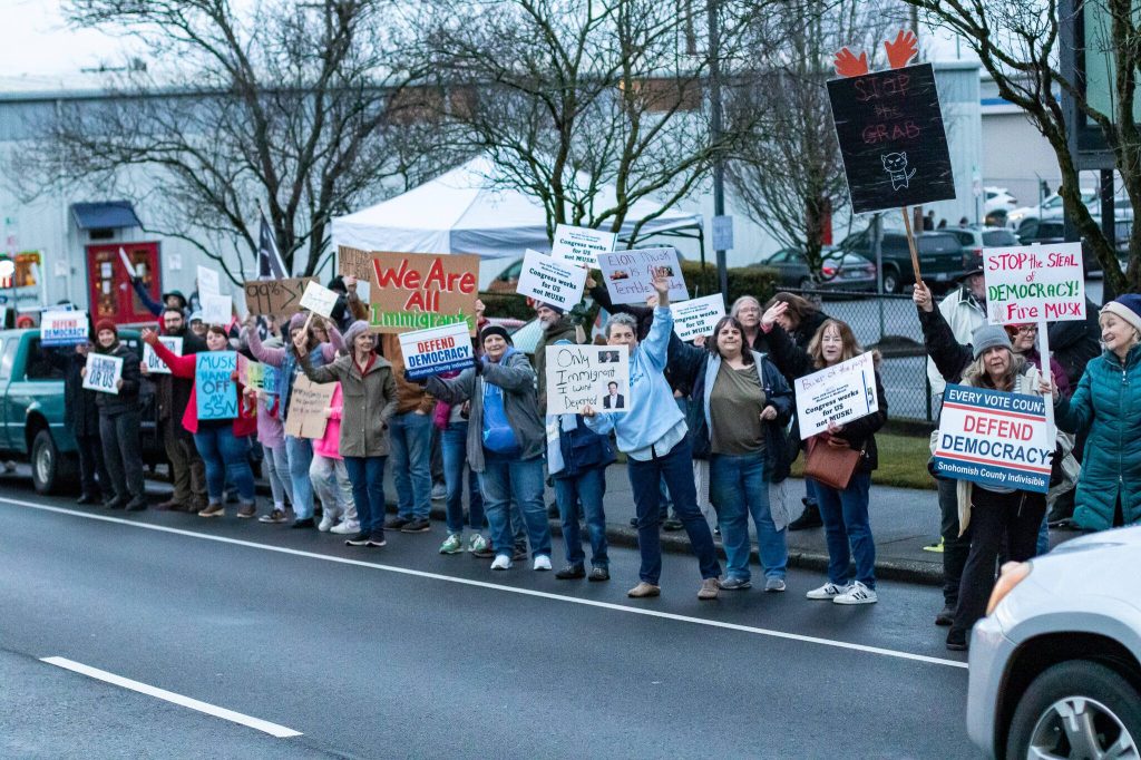 Aaron Kennedy / Daily Herald
In a gathering similar to many others across the nation on Presidents Day, hundreds lined Broadway with their signs and chants to protest the Trump administration Monday evening in Everett.
In a gathering similar to many others across the nation on Presidents Day, hundreds lined Broadway with their signs and chants to protest the Trump administration Monday evening in Everett. (Aaron Kennedy / Daily Herald)