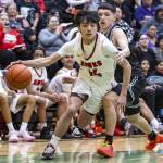 Tulalip Heritages James Jones drives to the hoop during the winner-to-state playoff game against Muckleshoot Tribal School on Tuesday, Feb. 18, 2025 in Marysville, Washington. (Olivia Vanni / The Herald)