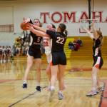 Monroe senior Halle Keller looks to split a couple Stanwood defenders in the Girls 3A Basketball District 1 semifinals at Marysville Pilchuck High School in Marysville, Washington on Feb. 18, 2025. (Joe Pohoryles / The Herald)