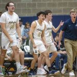 The Arlington bench reacts to a three point shot during the game against Glacier Peak on Friday, Jan. 17, 2025 in Arlington, Washington. (Olivia Vanni / The Herald)