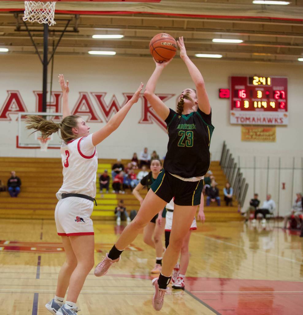 Shorecrest senior Cassie Chesnut (23) puts up a fadeaway shot against Snohomish junior Kendall Hammer (3) in the Girls 3A Basketball District 1 semifinals at Marysville Pilchuck High School in Marysville, Washington on Feb. 18, 2025. (Joe Pohoryles / The Herald)