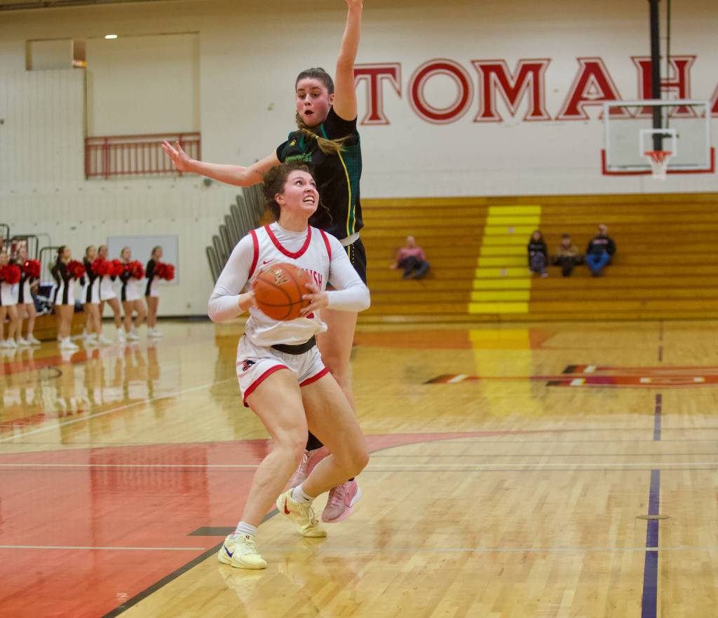 Shorecrest senior Cassie Chesnut jumps while anticipating a shot attempt from Snohomish senior Tyler Gildersleeve-Stiles in the Girls 3A Basketball District 1 semifinals at Marysville Pilchuck High School in Marysville, Washington on Feb. 18, 2025. (Joe Pohoryles / The Herald)