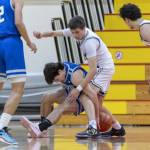 Shorewoods Jaden Marlow and Edmonds-Woodways William Alseth scramble for a loose ball during the 3A district semifinal game on Wednesday, Feb. 19, 2025 in Marysville, Washington. (Olivia Vanni / The Herald)