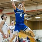 Shorewoods Thomas Moles makes a layup during the 3A district semifinal game against Edmonds-Woodway on Wednesday, Feb. 19, 2025 in Marysville, Washington. (Olivia Vanni / The Herald)