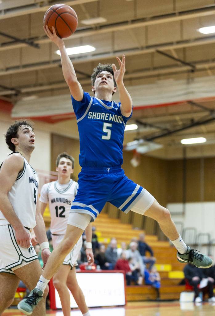 Shorewoods Thomas Moles makes a layup during the 3A district semifinal game against Edmonds-Woodway on Wednesday, Feb. 19, 2025 in Marysville, Washington. (Olivia Vanni / The Herald)