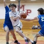 Edmonds-Woodways Grant Williams is fouled while taking the ball to the hoop during the 3A district semifinal game against Shorewood on Wednesday, Feb. 19, 2025 in Marysville, Washington. (Olivia Vanni / The Herald)