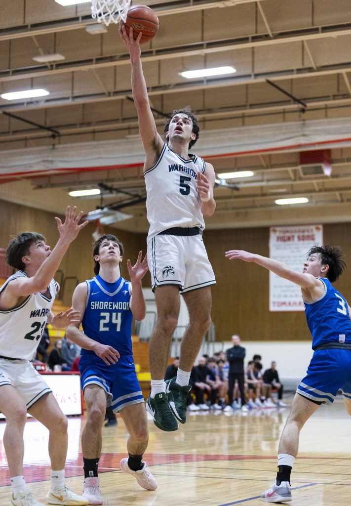 Edmonds-Woodways Cam Hiatt makes a layup during the 3A district semifinal game on Wednesday, Feb. 19, 2025 in Marysville, Washington. (Olivia Vanni / The Herald)