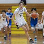 Edmonds-Woodways William Alseth takes the ball down the court during the 3A district semifinal game against Shorewood on Wednesday, Feb. 19, 2025 in Marysville, Washington. (Olivia Vanni / The Herald)