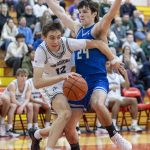 Edmonds-Woodways William Alseth tries to dribble around Shorewoods Jaden Marlow during the 3A district semifinal game on Wednesday, Feb. 19, 2025 in Marysville, Washington. (Olivia Vanni / The Herald)