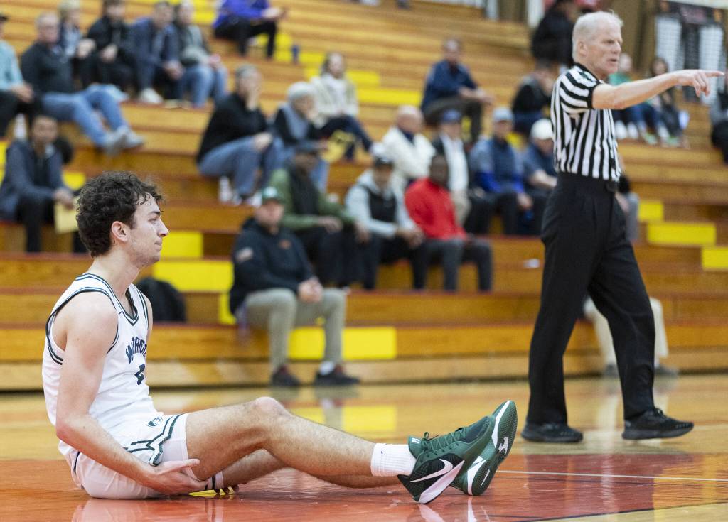Edmonds-Woodways Cam Hiatt reacts to drawing a foul during the 3A district semifinal game against Shorewood on Wednesday, Feb. 19, 2025 in Marysville, Washington. (Olivia Vanni / The Herald)
