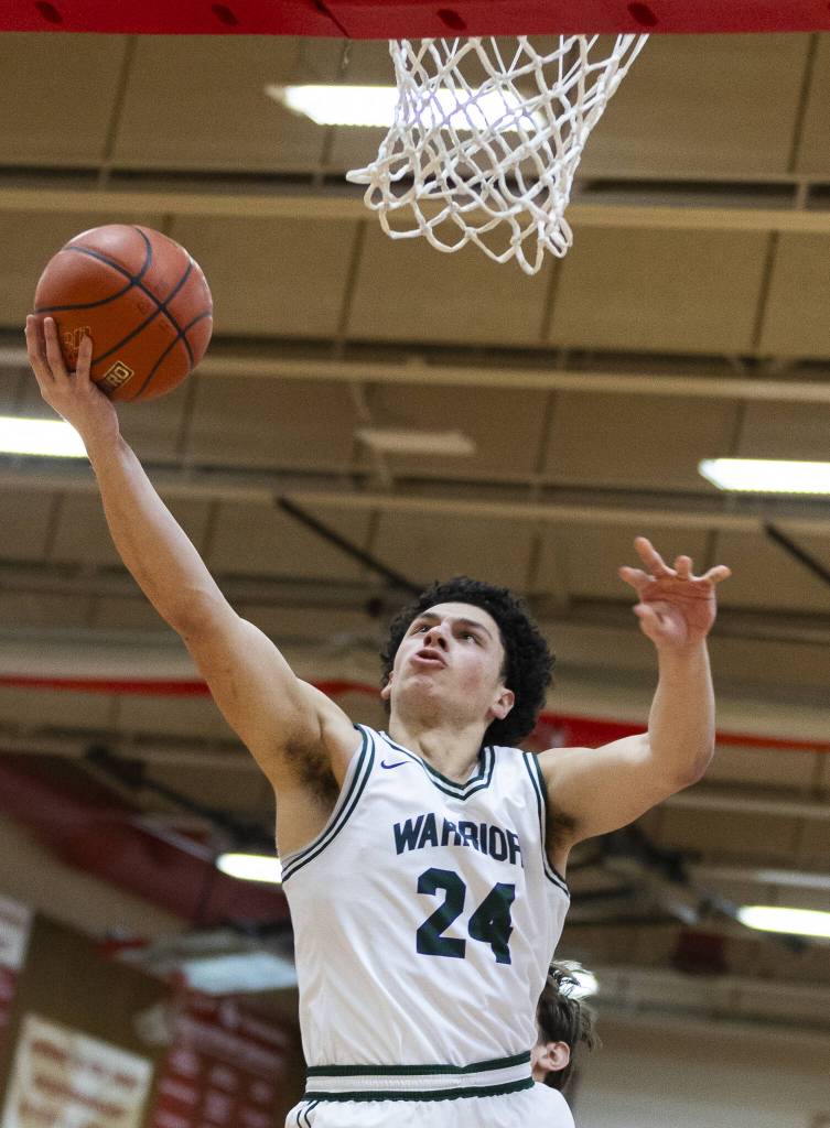 Edmonds-Woodways Julian Gray makes a layup during the 3A district semifinal game against Shorewood on Wednesday, Feb. 19, 2025 in Marysville, Washington. (Olivia Vanni / The Herald)