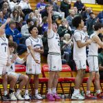 The Edmonds-Woodway bench reacts to a 3-point shot during the 3A district semifinal game against Shorewood on Wednesday, Feb. 19, 2025 in Marysville, Washington. (Olivia Vanni / The Herald)