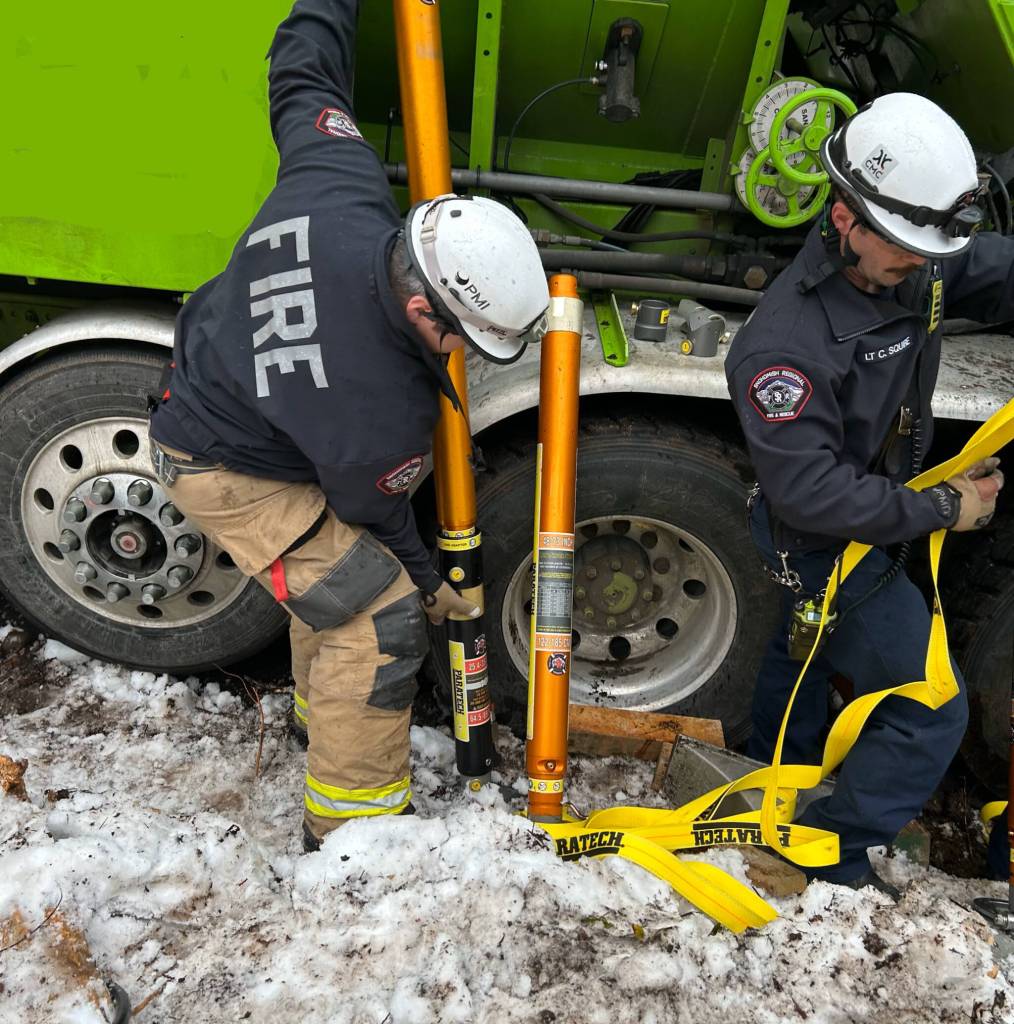 First responders work to stabilize a cement truck before rescuing a person trapped underneath Wednesday morning in Skykomish. (Snohomish Regional Fire & Rescue)