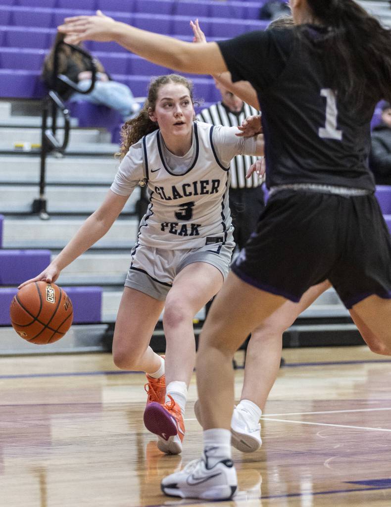 Glacier Peaks Brynna Pukis tries to find an open lane to the basket during the 4A district loser-out playoff game against North Creek on Thursday, Feb. 20, 2025 in Kirkland, Washington. (Olivia Vanni / The Herald)