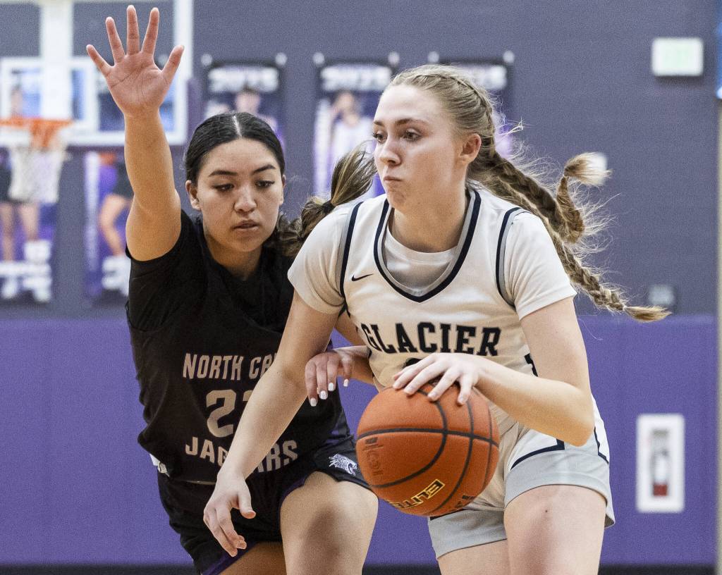 Glacier Peaks Rikki Miller dribbles toward the basket during the 4A district loser-out playoff game against North Creek on Thursday, Feb. 20, 2025 in Kirkland, Washington. (Olivia Vanni / The Herald)