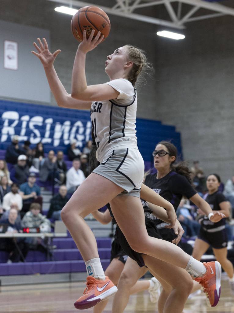 Glacier Peaks Rikki Miller makes a layup during the 4A district loser-out playoff game against North Creek on Thursday, Feb. 20, 2025 in Kirkland, Washington. (Olivia Vanni / The Herald)