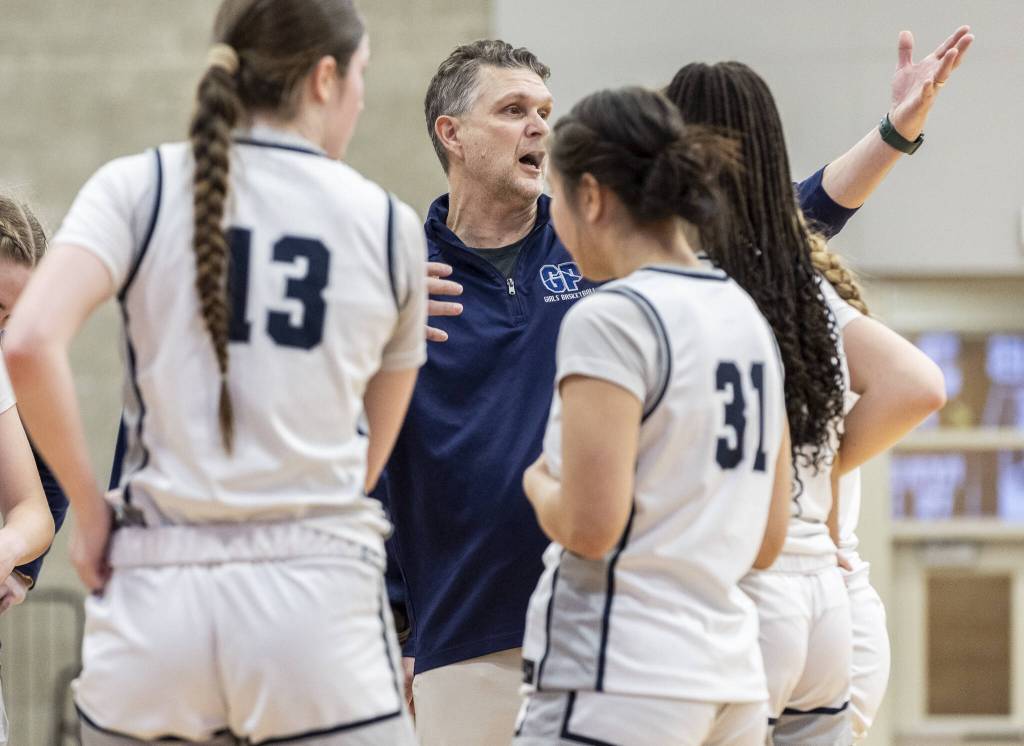 Glacier Peak head coach Brian Hill talks to his team during a timeout during the 4A district loser-out playoff game against North Creek on Thursday, Feb. 20, 2025 in Kirkland, Washington. (Olivia Vanni / The Herald)
