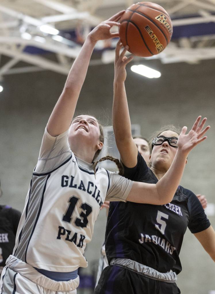 Glacier Peaks Samantha Thoma reaches up for a rebound during the 4A district loser-out playoff game against North Creek on Thursday, Feb. 20, 2025 in Kirkland, Washington. (Olivia Vanni / The Herald)