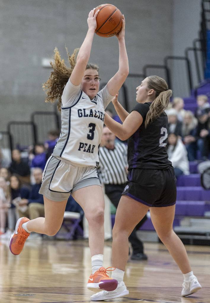 Glacier Peaks Brynna Pukis lifts the ball in the air as she maneuvers toward the hoop for a layup during the 4A district loser-out playoff game against North Creek on Thursday, Feb. 20, 2025 in Kirkland, Washington. (Olivia Vanni / The Herald)
