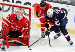Team USA's Auston Matthews (34) tries to put the puck in past Canada's Cale Makar (8) and goaltender Jordan Binnington (50) during the first period of the NHL 4 Nations Face-Off Championship Game at TD Garden on Thursday, Feb. 20, 2025, in Boston. (Matt Stone / Boston Herald / Tribune News Services)