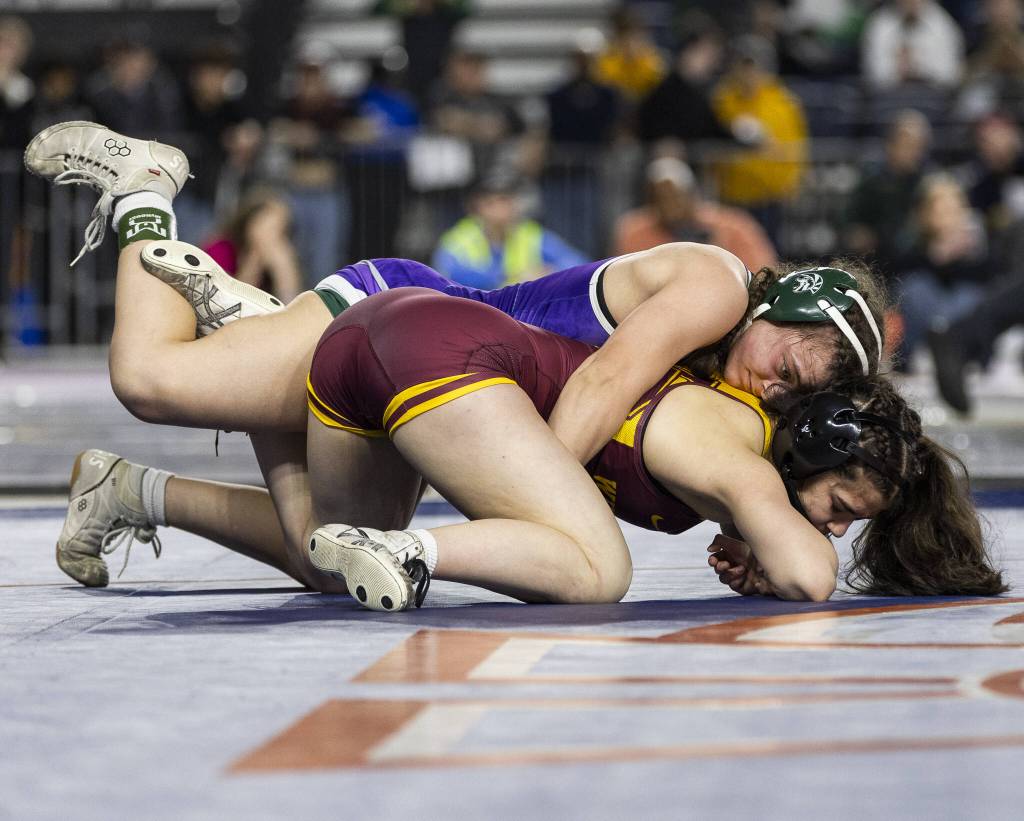 Edmonds-Woodways Hannah Baldock gets control of her opponents back during the 3A girls 140-pound championship match at the Mat Classic on Friday, Feb. 21, 2025 in Tacoma, Washington. (Olivia Vanni / The Herald)