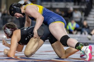 Everett’s Mia Cienga gets control of her opponent's foot during the 190-pound 3A girls championship match at the Mat Classic on Friday, Feb. 21, 2025 in Tacoma, Washington. (Olivia Vanni / The Herald)