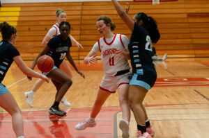 Meadowdale defenders force a loose ball on Snohomish during a Feb. 22, 2025 District 1 3A playoff game at Marysville Pilchuck High School. (Qasim Ali / The Herald)