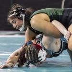 Jacksons Emily Ortiz cries and hugs her coach, Chey Kawaihae, after winning the at the 4A girls 145-pound championship title Mat Classic on Friday, Feb. 21, 2025 in Tacoma, Washington. (Olivia Vanni / The Herald)
