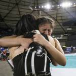 Jacksons Emily Ortiz cries and hugs her coach, Chey Kawaihae, after winning the 4A girls 145-pound championship title Mat Classic on Friday, Feb. 21, 2025 in Tacoma, Washington. (Olivia Vanni / The Herald)