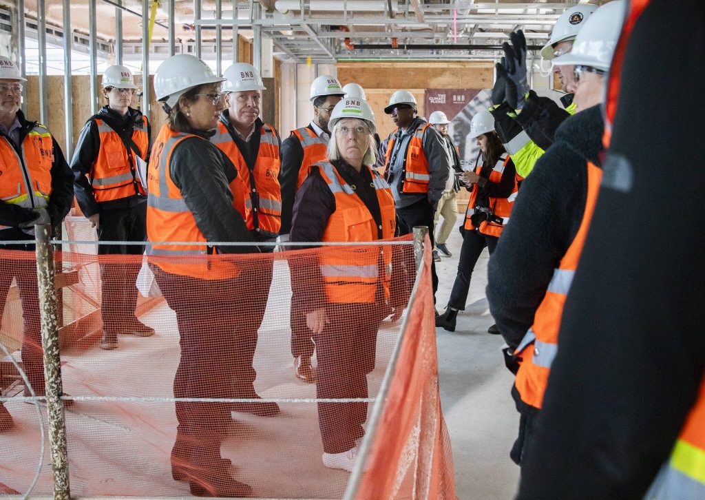 Senior Project Manager Adam Smith talks to U.S. Sen. Patty Murray and others about the ongoing construction of Compass Healths new behavioral health facility Friday in Everett. (Olivia Vanni / The Herald)