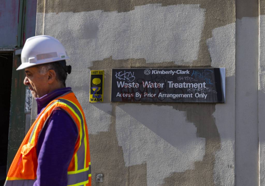 Utilities Engineering Manager Souheil Nasr stands next to a tagged sign on the former Kimberly-Clark Waste Water Treatment building at the Port Gardner Storage Facility on Thursday, Feb. 27, 2025 in Everett, Washington. (Olivia Vanni / The Herald)