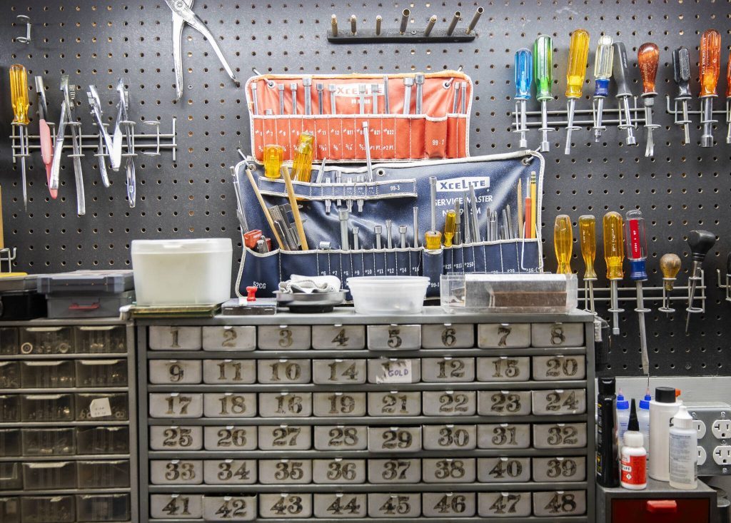 Different tools and pieces are used for accordion repairs and maintenance. (Olivia Vanni / The Herald)