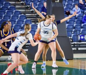 Meadowdale senior Audrey Lucas (35) backs against a Bellevue defender in the post during the Mavericks' 69-54 loss in the Girls 3A State Tournament Round of 12 in Tacoma, Washington on March 5, 2025. (Joe Pohoryles / The Herald)