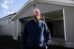 Our Lady of Hope Fr. Joseph Altenhofen outside of his parish’s building that will be the new home of Hope ‘N Wellness on Wednesday, March 5, 2025 in Everett, Washington. (Olivia Vanni / The Herald)
