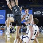 Glacier Peaks Reed Nagel runs into Gonzaga Preps Hudson Floyd while trying to make a jump shot during the 4A boys semifinal game on Friday, March 7, 2025 in Tacoma, Washington. (Olivia Vanni / The Herald)