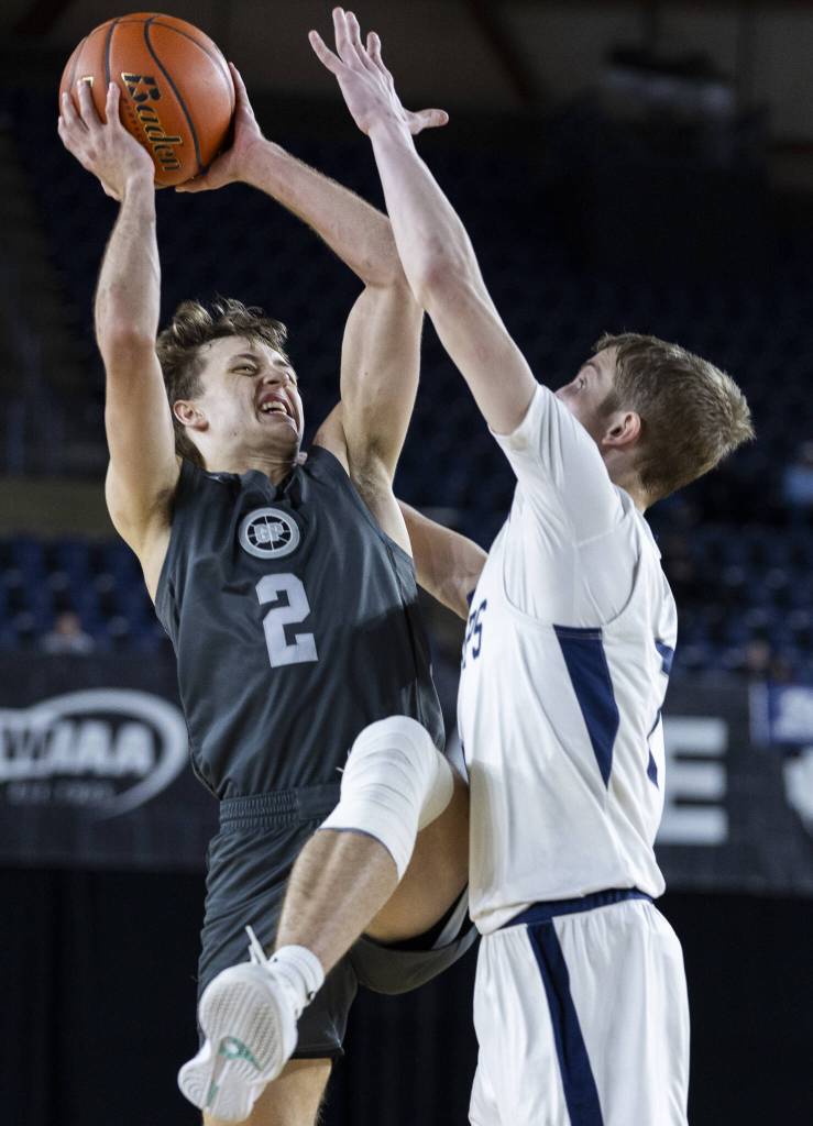 Glacier Peaks Jo Lee tries to get a shot off while being guarded by Gonzaga Preps Veer Nagra during the 4A boys semifinal game against Gonzaga Prep on Friday, March 7, 2025 in Tacoma, Washington. (Olivia Vanni / The Herald)