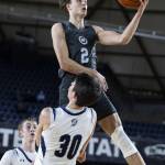 Glacier Peaks Jo Lee leaps in the air to make a shot during the 4A boys semifinal game against Gonzaga Prep on Friday, March 7, 2025 in Tacoma, Washington. (Olivia Vanni / The Herald)