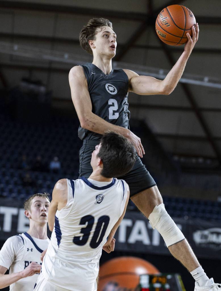 Glacier Peaks Jo Lee leaps in the air to make a shot during the 4A boys semifinal game against Gonzaga Prep on Friday, March 7, 2025 in Tacoma, Washington. (Olivia Vanni / The Herald)