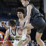 Glacier Peaks Reed Nagel leaps in the air to try and get a rebound during overtime at the 4A boys semifinal game against Gonzaga Prep on Friday, March 7, 2025 in Tacoma, Washington. (Olivia Vanni / The Herald)