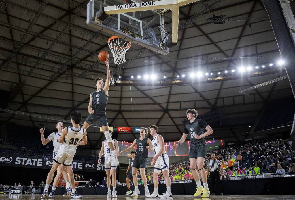 Glacier Peaks Jo Lee leaps in the air to make a shot during the 4A boys semifinal game against Gonzaga Prep on Friday, March 7, 2025 in Tacoma, Washington. (Olivia Vanni / The Herald)