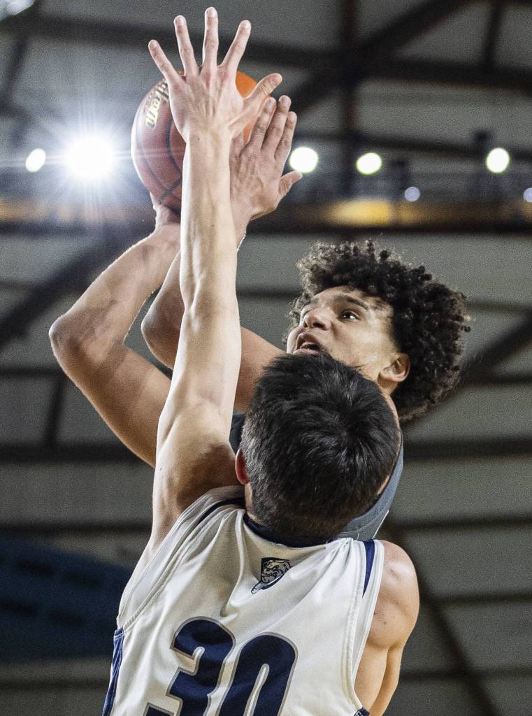 Glacier Peaks Jayce Nelson tries to take a jump shot while being guarded by Gonzaga Preps Carter Nelson during the 4A boys semifinal game on Friday, March 7, 2025 in Tacoma, Washington. (Olivia Vanni / The Herald)