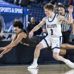 Glacier Peaks Jayce Nelson leaps for a loose ball during the 4A boys semifinal game against Gonzaga Prep on Friday, March 7, 2025 in Tacoma, Washington. (Olivia Vanni / The Herald)
