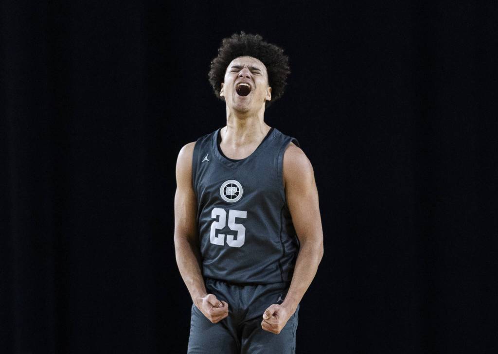 Glacier Peaks Jayce Nelson reacts to his teammate making a three-point shot during the 4A boys semifinal game against Gonzaga Prep on Friday, March 7, 2025 in Tacoma, Washington. (Olivia Vanni / The Herald)