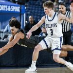 Glacier Peak’s Jayce Nelson leaps for a loose ball during the 4A boys semifinal game against Gonzaga Prep on Friday, March 7, 2025 in Tacoma, Washington. (Olivia Vanni / The Herald)