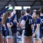 The Glacier Peak girls basketball team huddles at the end of a timeout during a March 5, 2025 state playoff game at the Tacoma Dome. (Qasim Ali / The Herald)