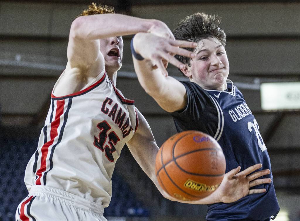 Glacier Peaks Zachary Albright reaches out for a rebound during the 4A boys quarterfinal game against Camas on Thursday, March 6, 2025 in Tacoma, Washington. (Olivia Vanni / The Herald)