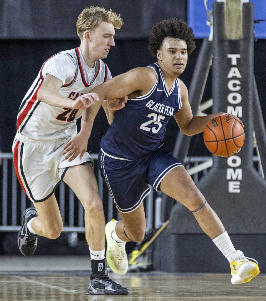 Glacier Peaks Jayce Nelson takes the ball down the court during the 4A boys quarterfinal game against Camas on Thursday, March 6, 2025 in Tacoma, Washington. (Olivia Vanni / The Herald)